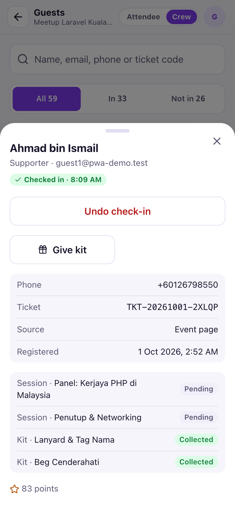 Guest details panel with Undo check-in, Give kit, ticket details, session and kit statuses